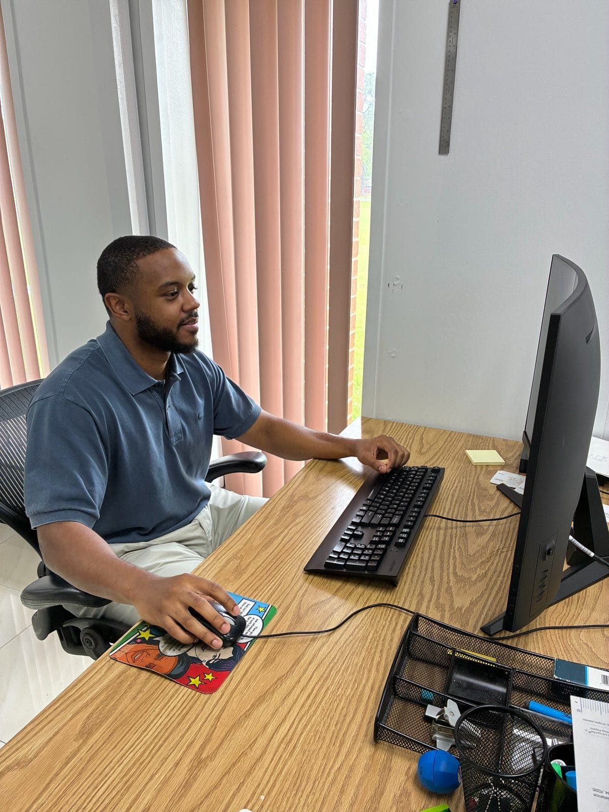 Dove Direct IT and infosec team member at his workstation